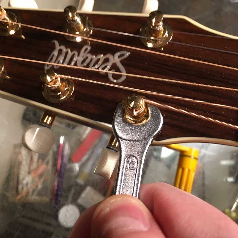 Pro Guitar Setup tightening tuner bushings