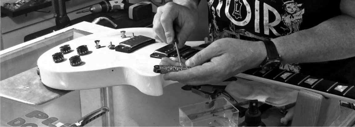 Detailing a Les Paul bridge during a Professional Guitar Setup