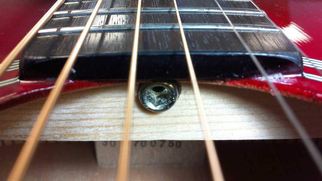 Acoustic truss rod adjuster