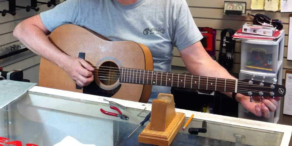 tuning an acoustic guitar, tools for changing guitar strings