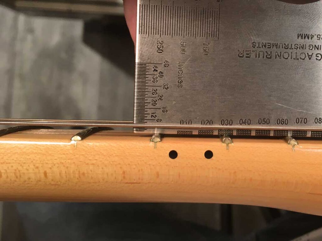 Measuring sixth string height at the 12th fret