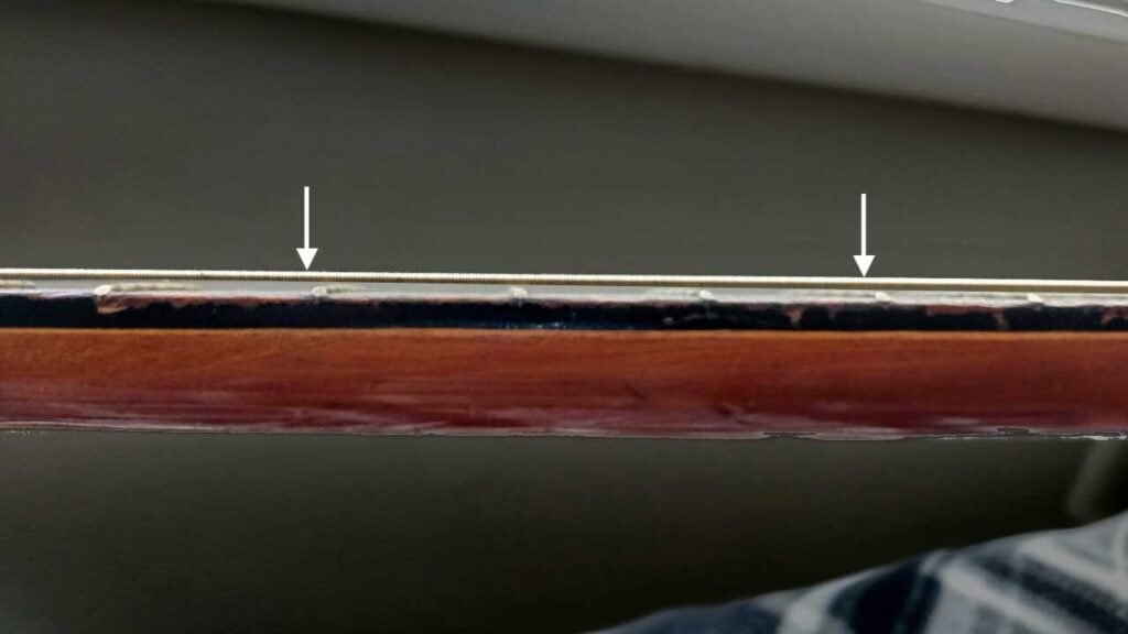 Why Do My Guitar Strings Buzz? (The Top 5 Reasons)